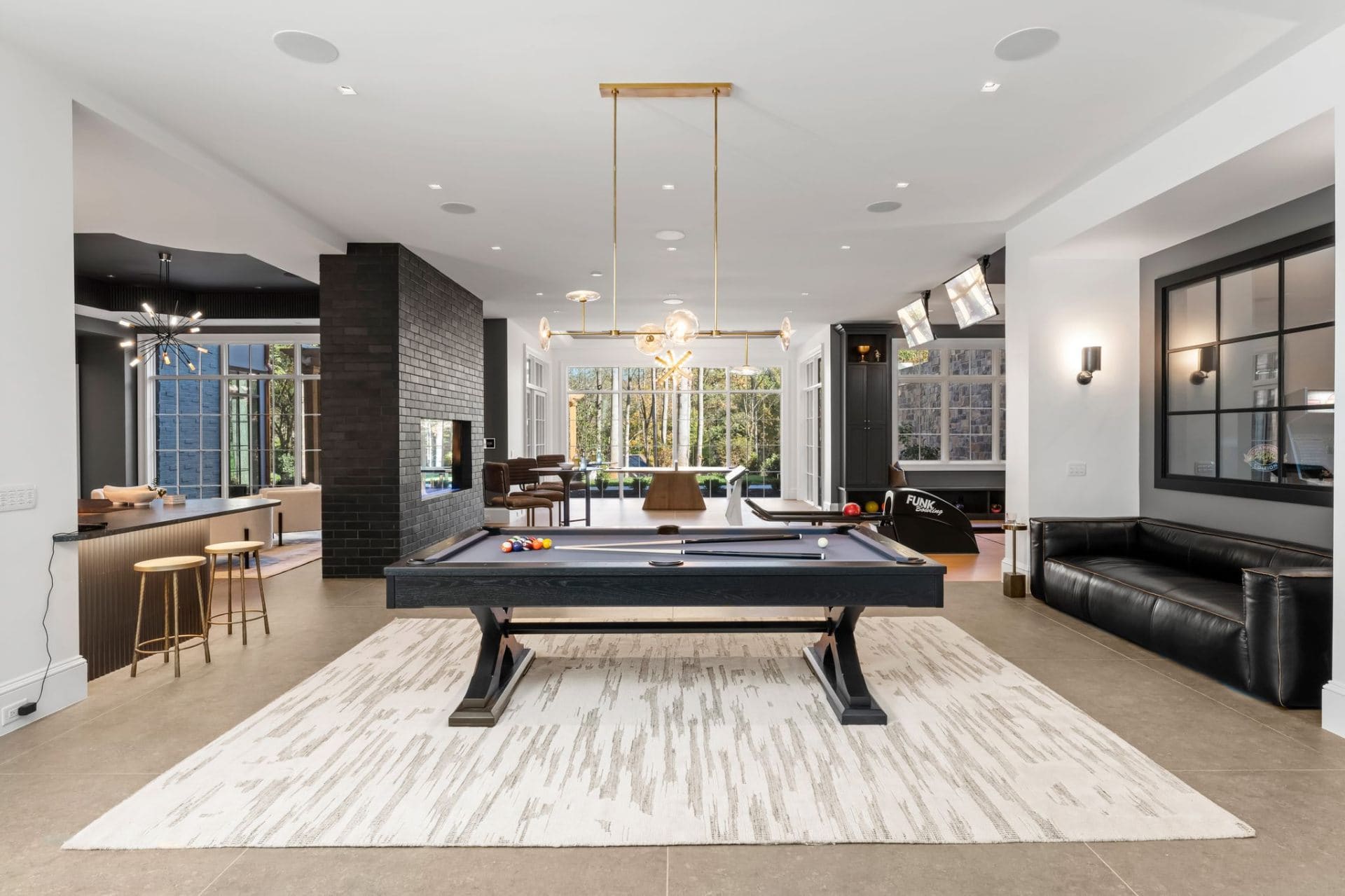 Billiards room with fireplace detail