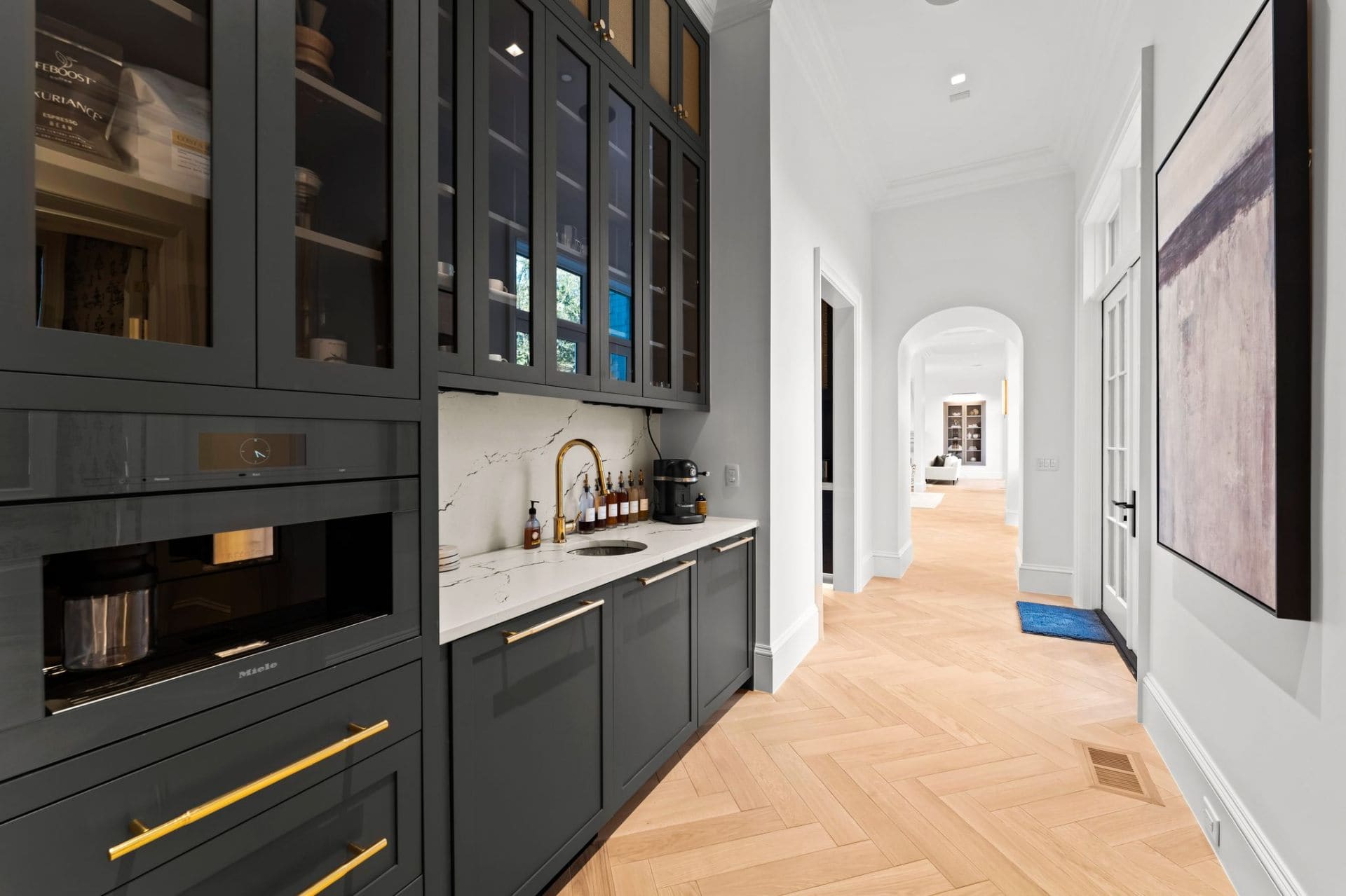 Butler's pantry with Miele espresso and gold hardware