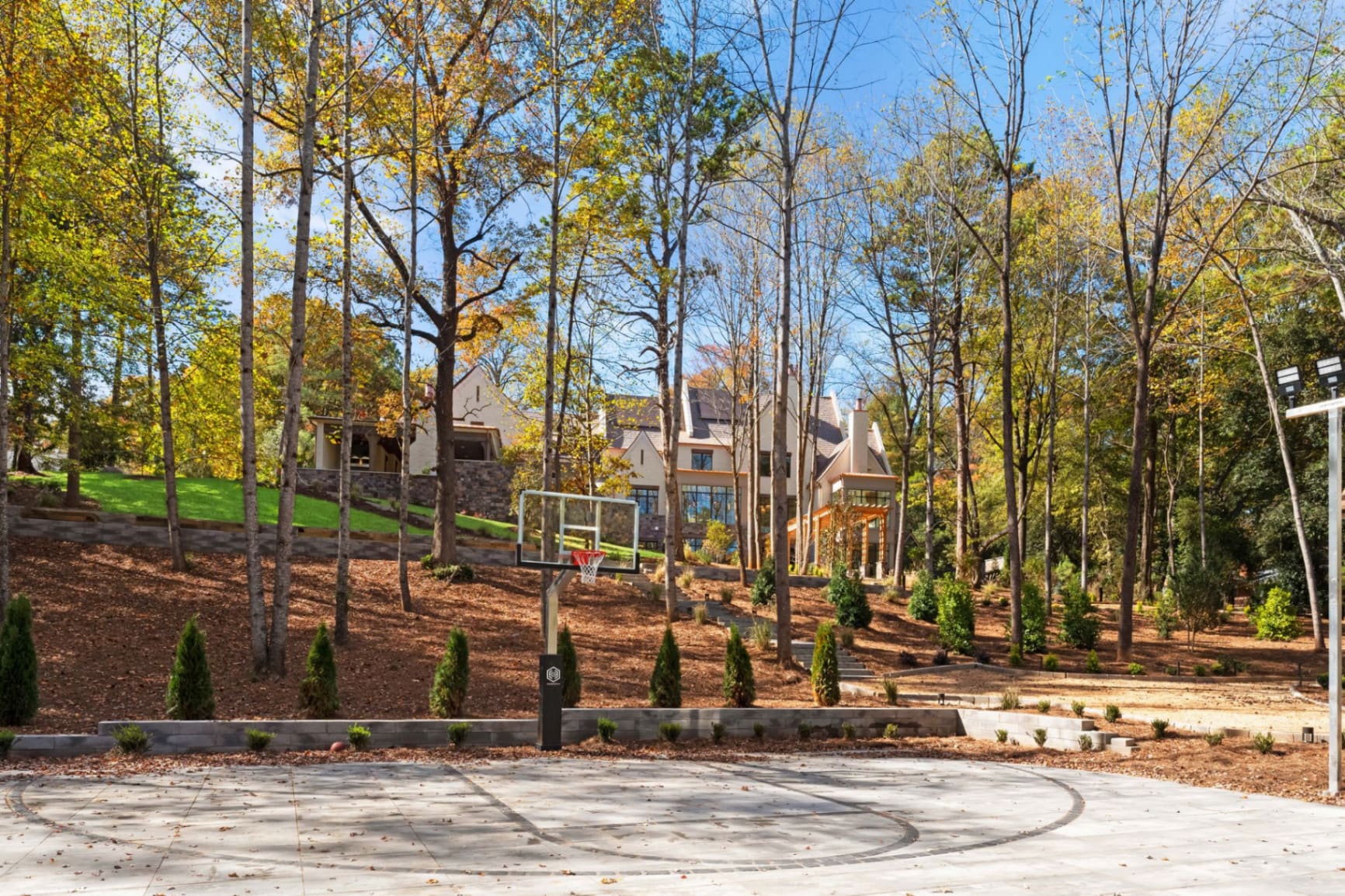Basketball court with estate beyond
