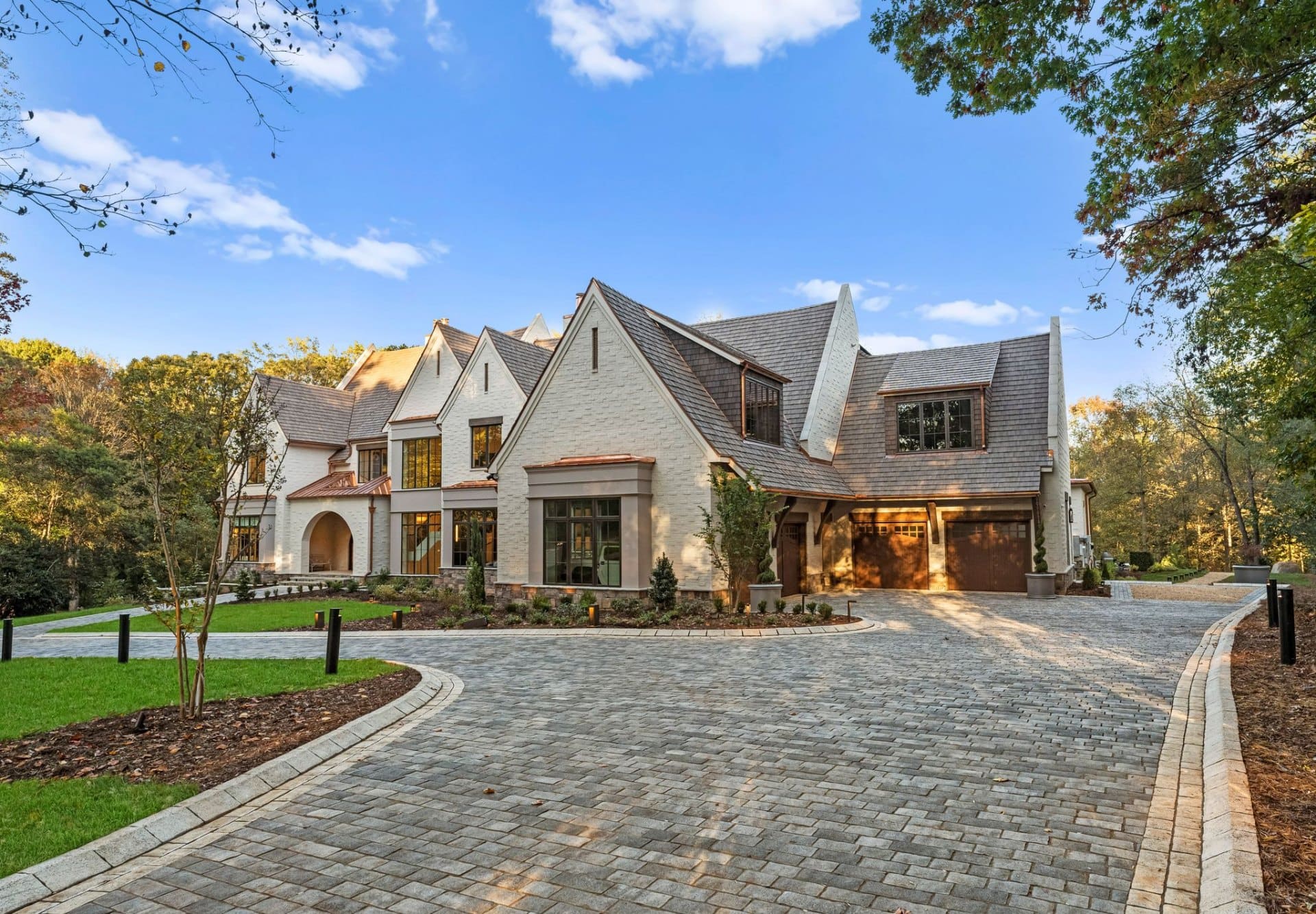 Front facade with cobblestone driveway