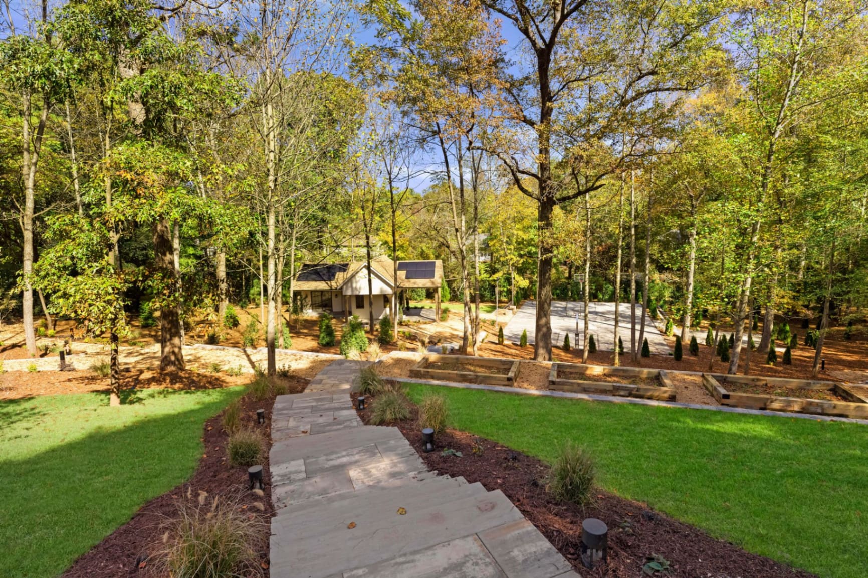 Grounds overview with guest house and court