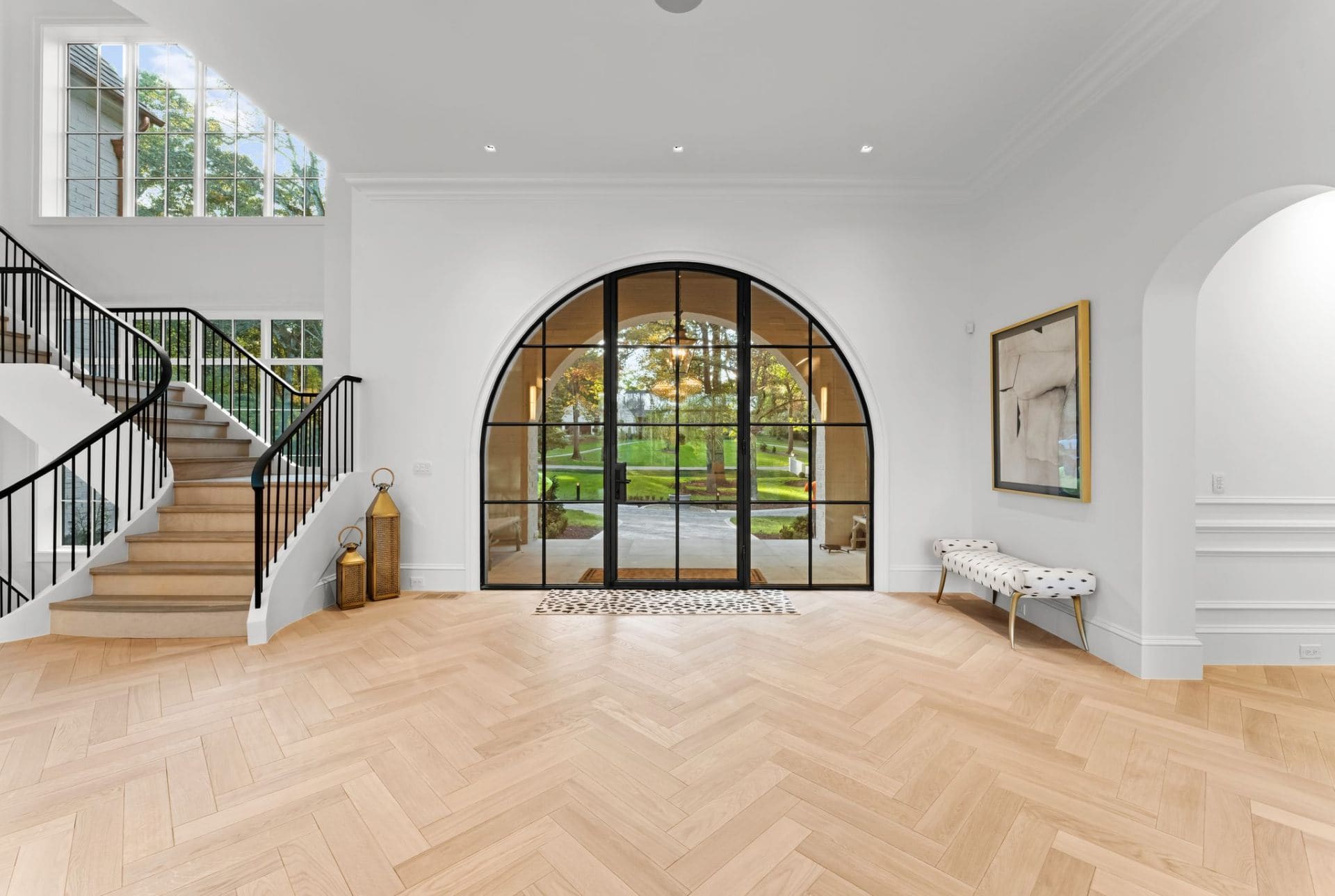 Grand entry with arched steel door