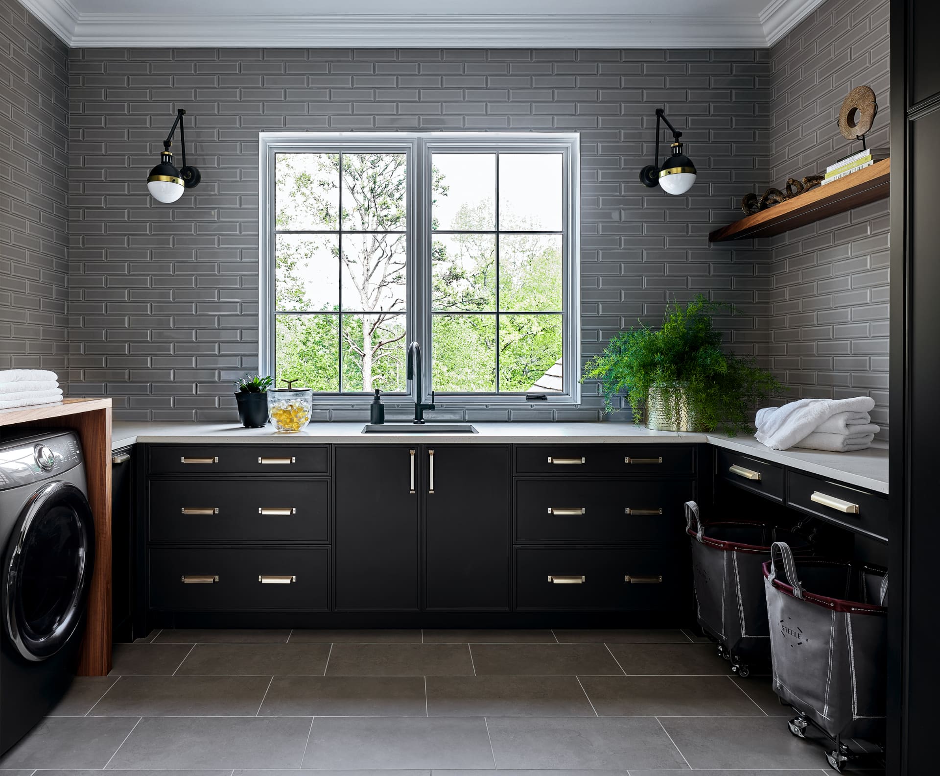 Dark laundry room wide view with garden window