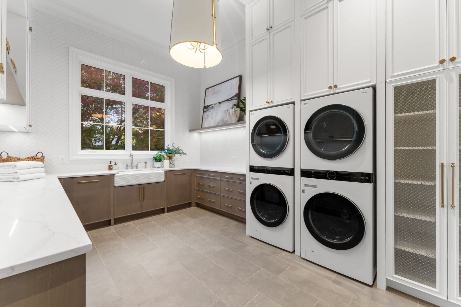 Laundry suite with stacked washer-dryers