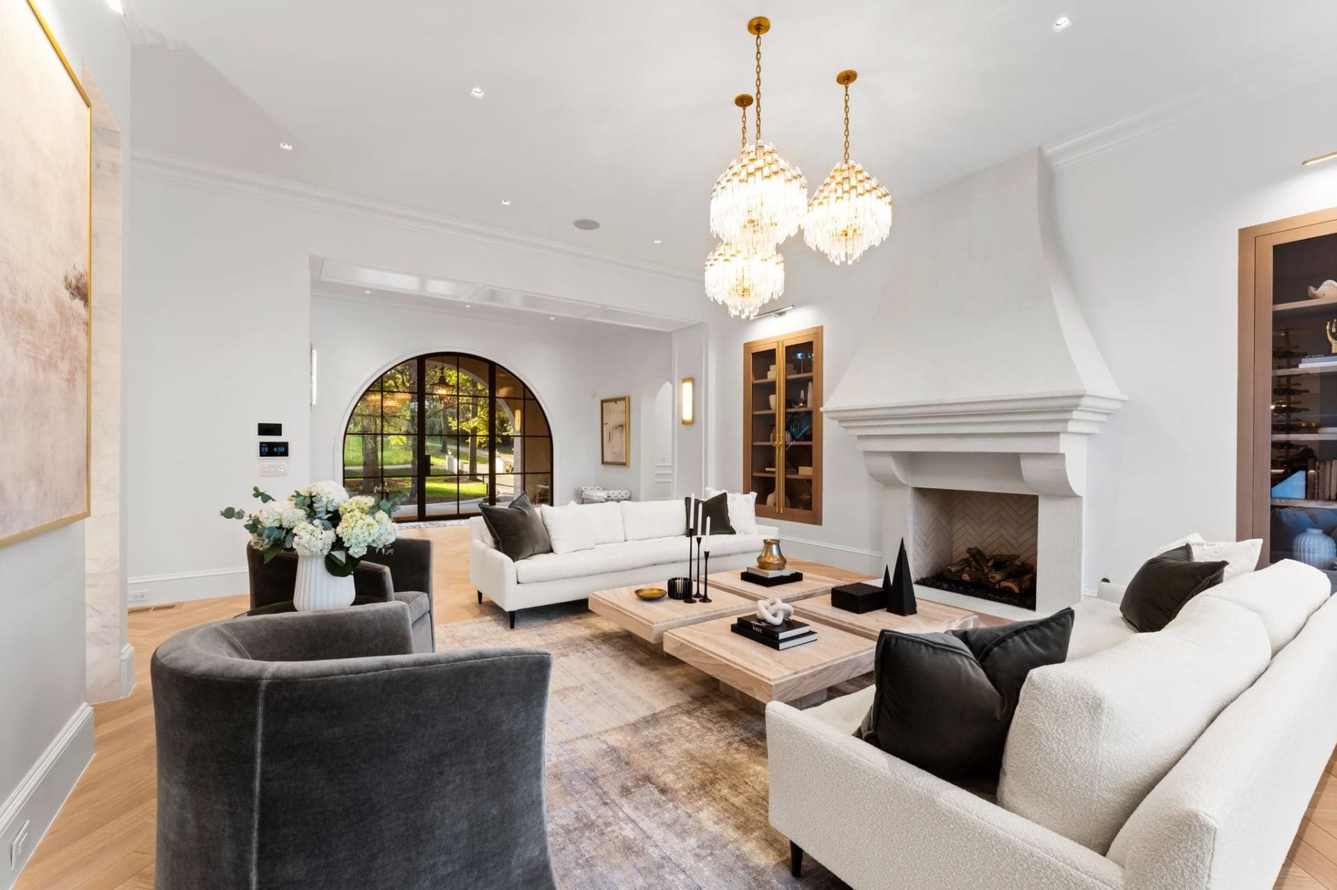 Living room with fireplace and arched window
