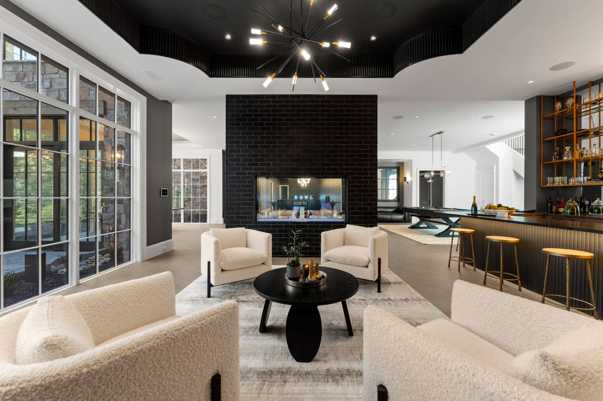 Entertainment lounge with fireplace and bar
