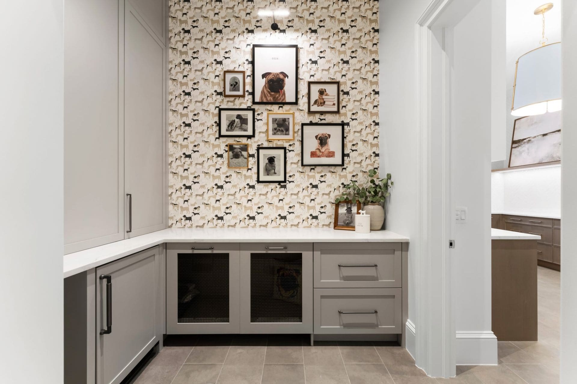 Pet suite gallery wall with kennel cabinetry