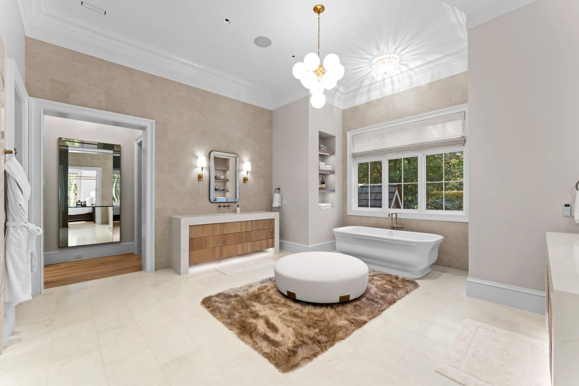 Primary bath with soaking tub and bubble chandelier