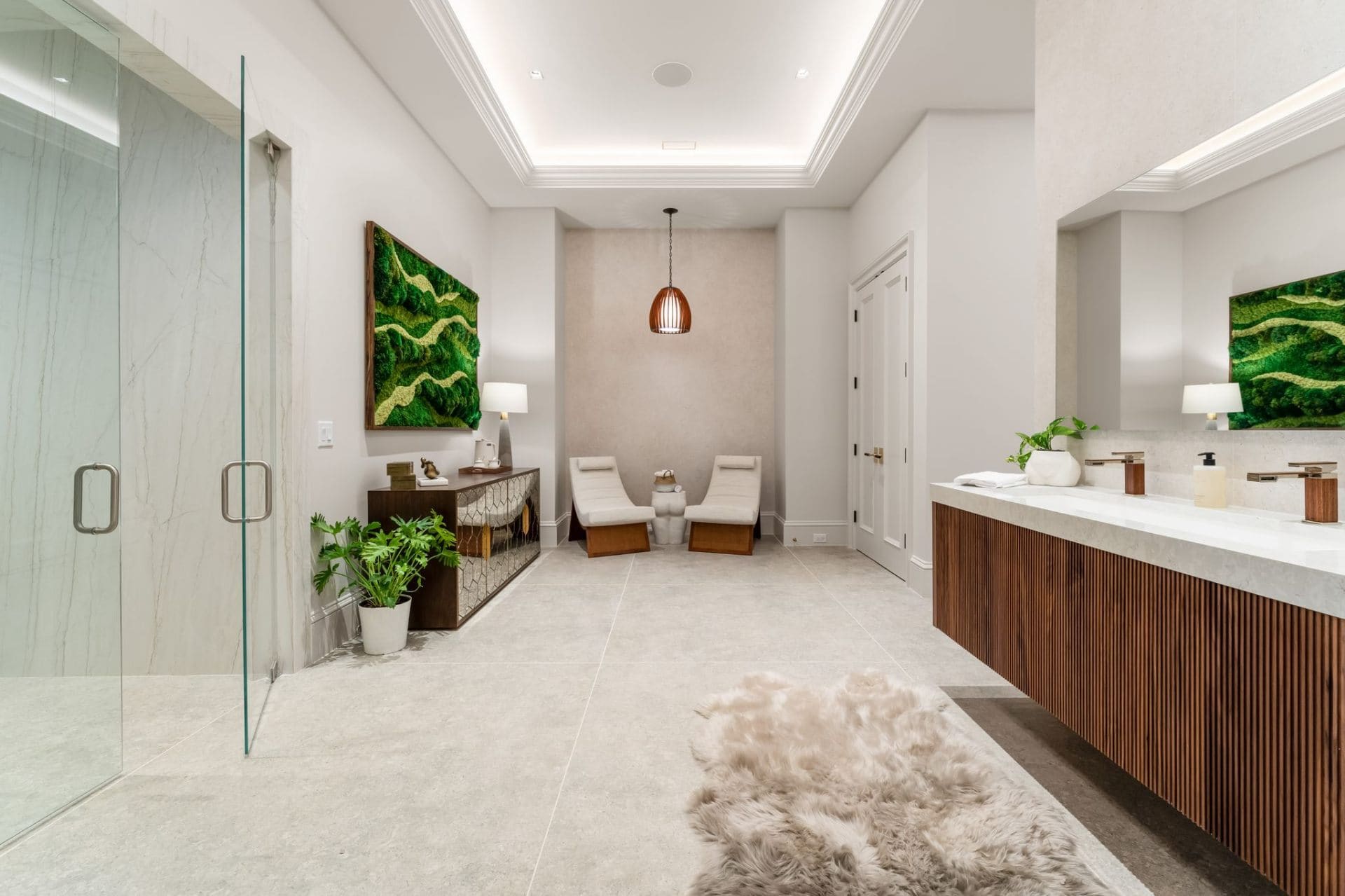 Spa lounge with moss art and marble vanity