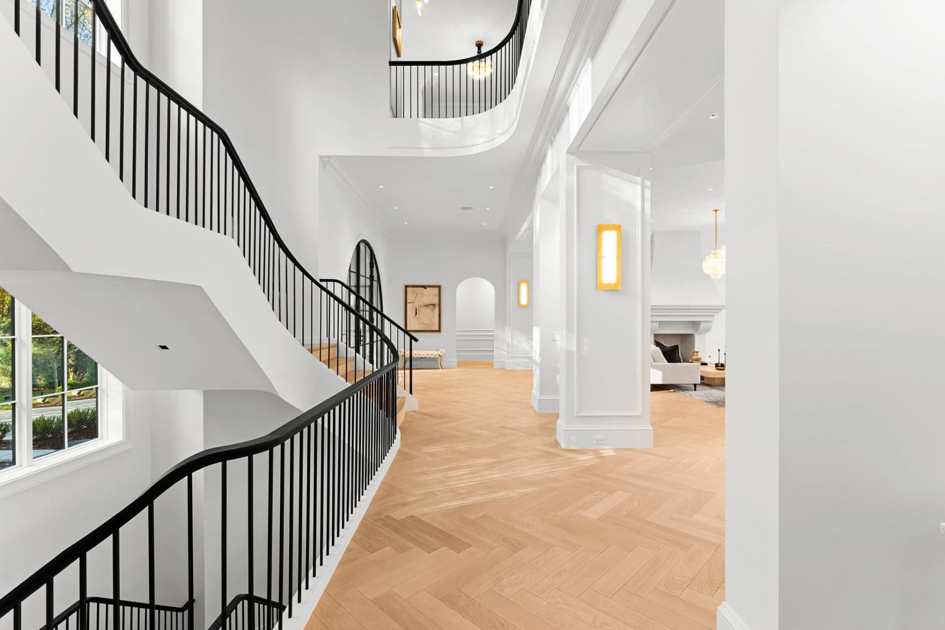 Staircase hallway with herringbone floors
