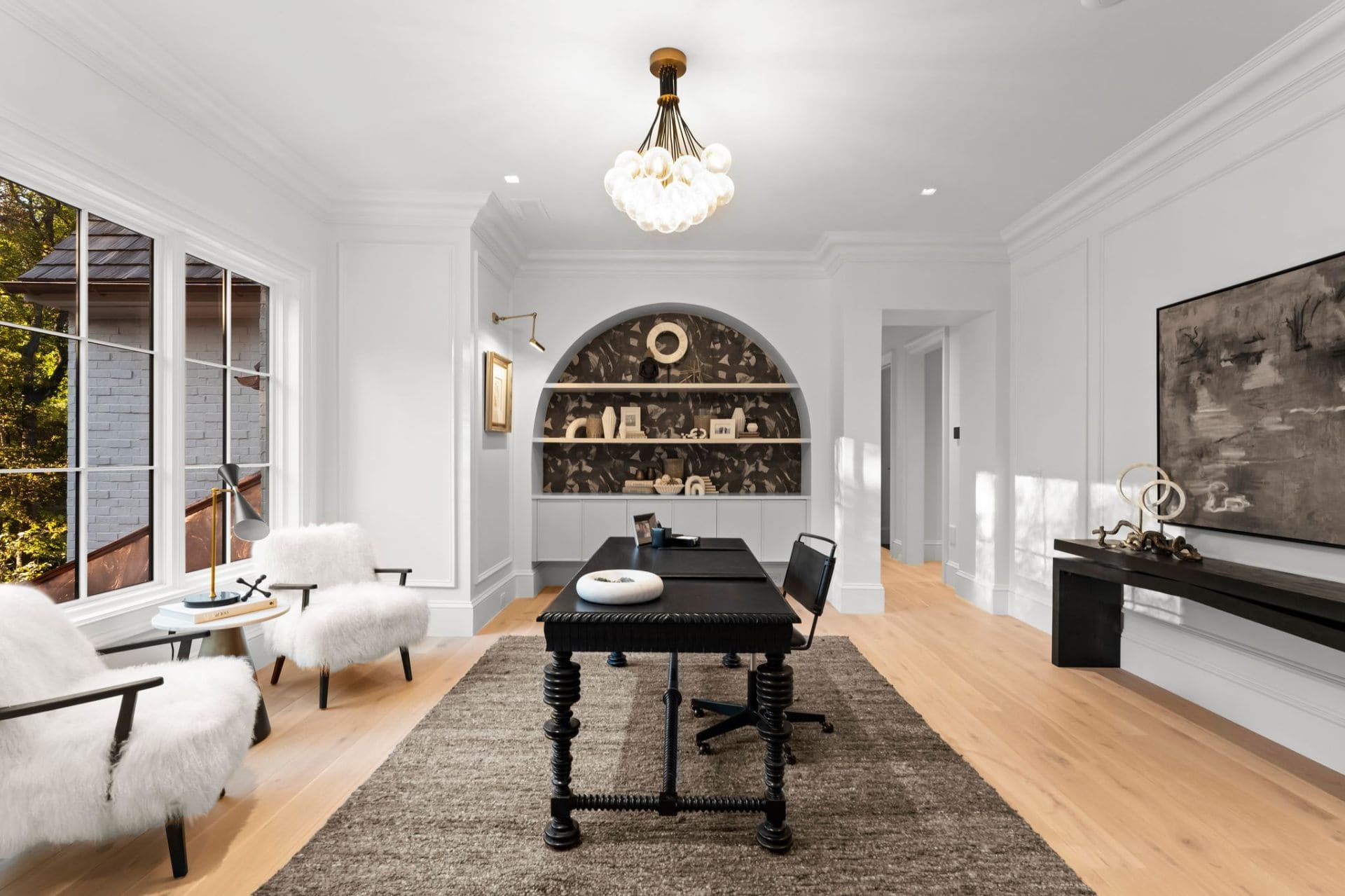 Upper office with arched niche and bubble chandelier
